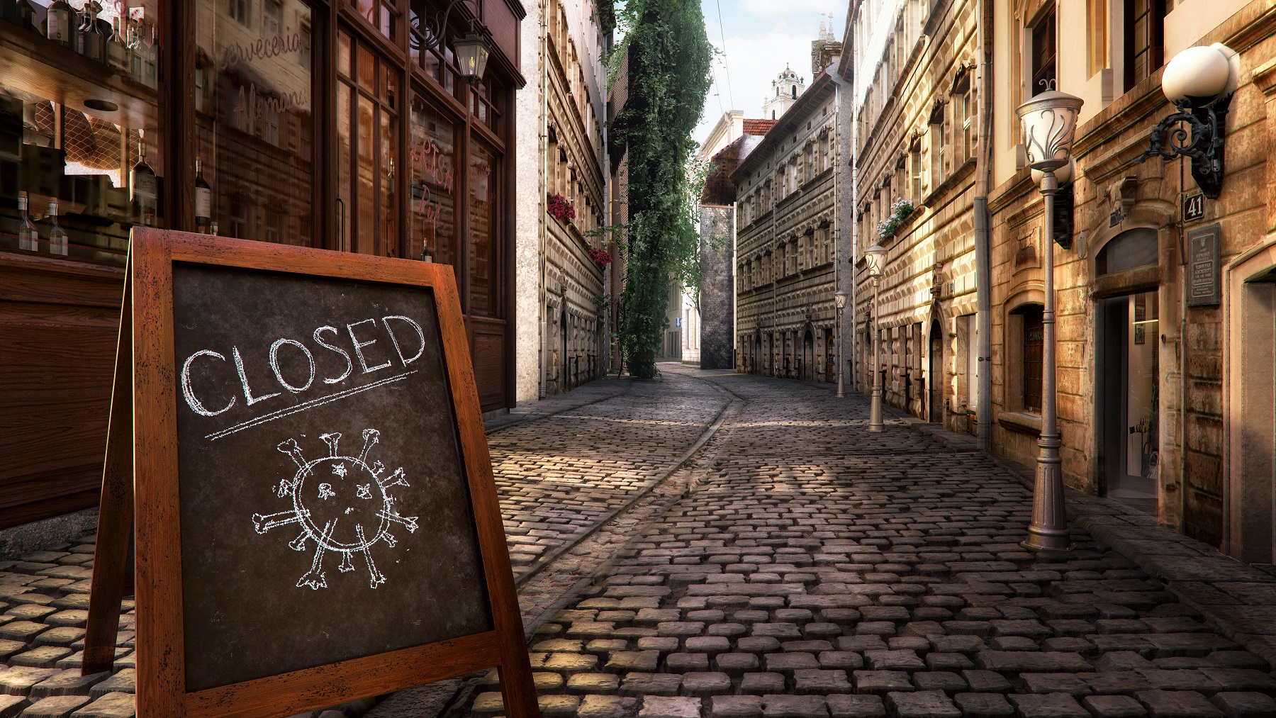  Empty city street with a closed sign displaying a coronavirus symbol.