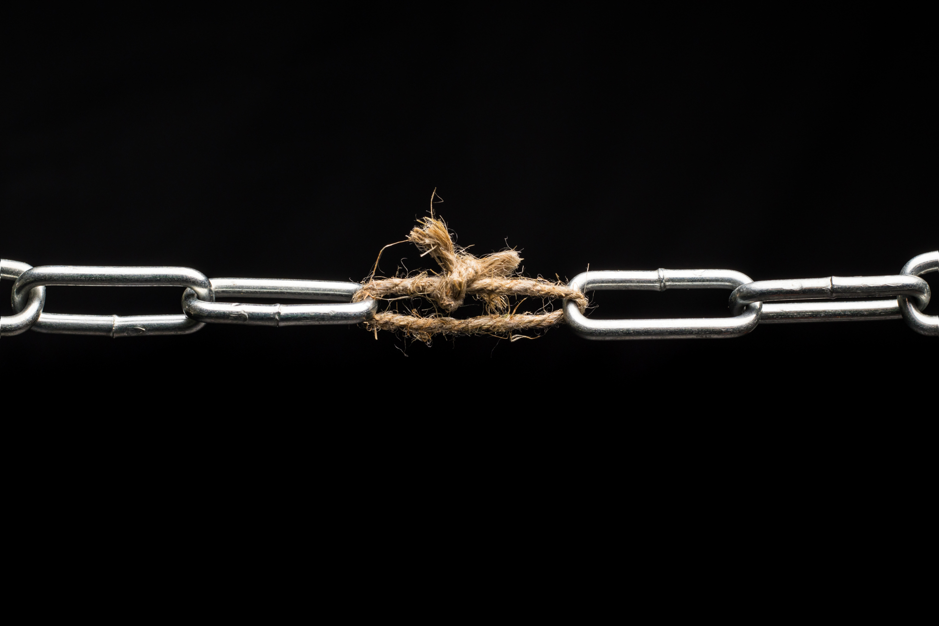 A chain with one link replaced by a loop of rope